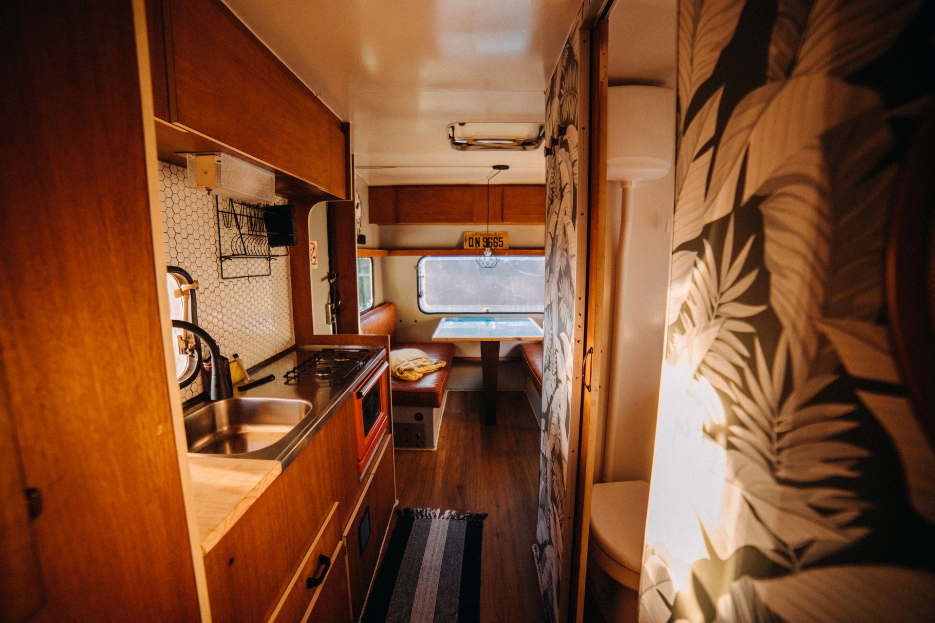Renovated RV kitchenette with warm retro styling